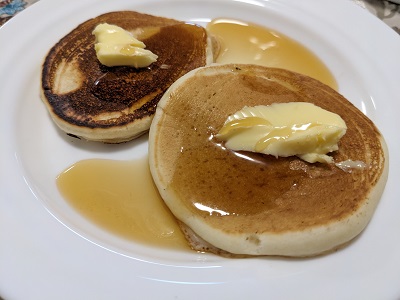 buttermilk pancakes with butter and maple syrup